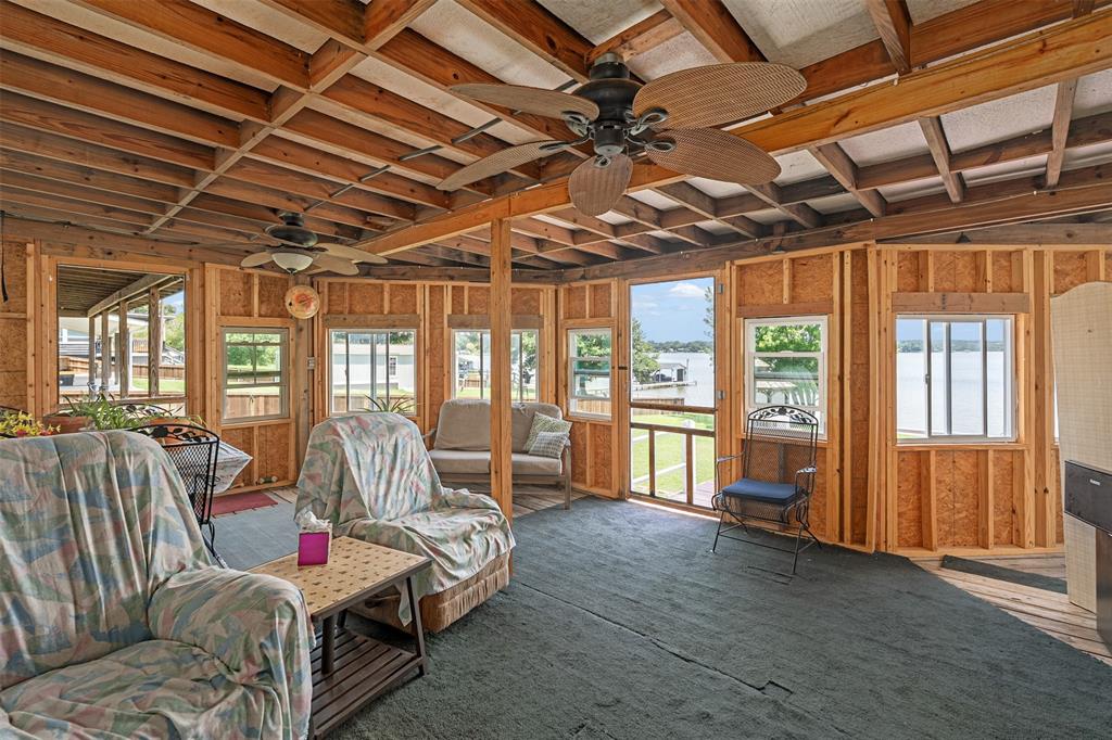 175 Kings Row Malakoff, TX 75148 - Photo 26 of 40 a bed room with furniture and a chandelier