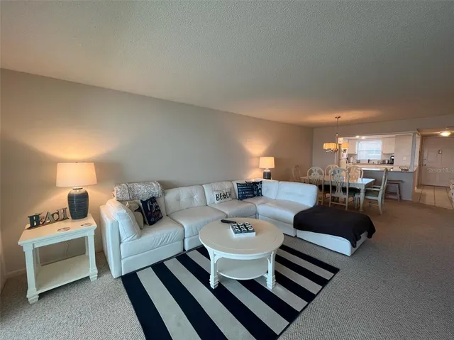 a living room with furniture and a table