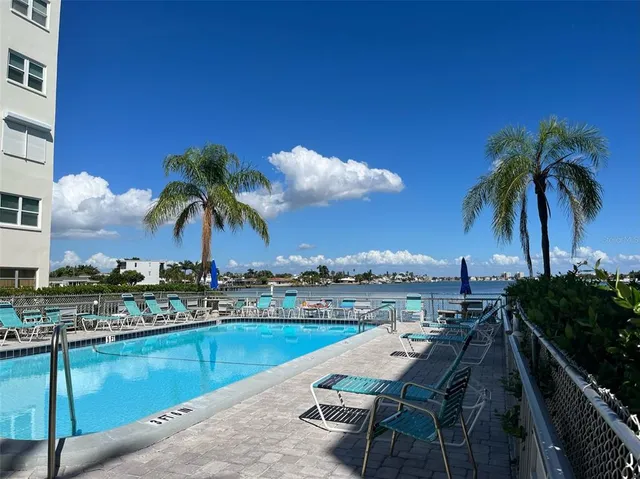 a view of swimming pool with outdoor seating