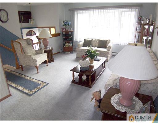 54 Oxford Road Colonia, NJ 07067 - Photo 2 of 18 a living room with furniture and a large window