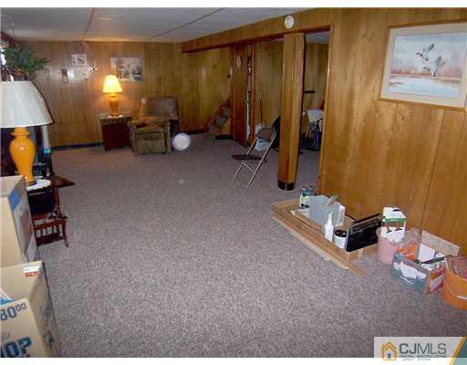 54 Oxford Road Colonia, NJ 07067 - Photo 13 of 18 a room with furniture and a lamp