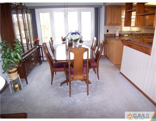 54 Oxford Road Colonia, NJ 07067 - Photo 3 of 18 a dining room with furniture and window