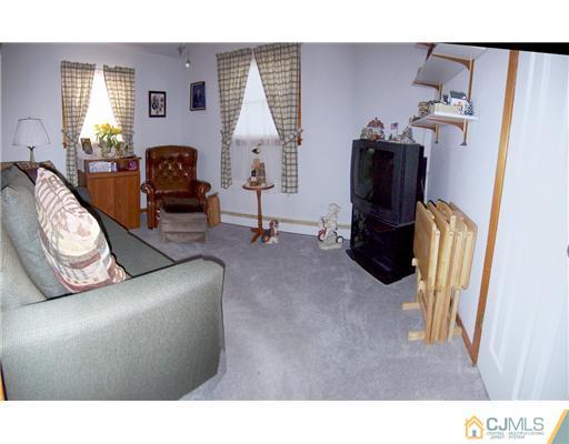 54 Oxford Road Colonia, NJ 07067 - Photo 7 of 18 a living room with furniture and a window