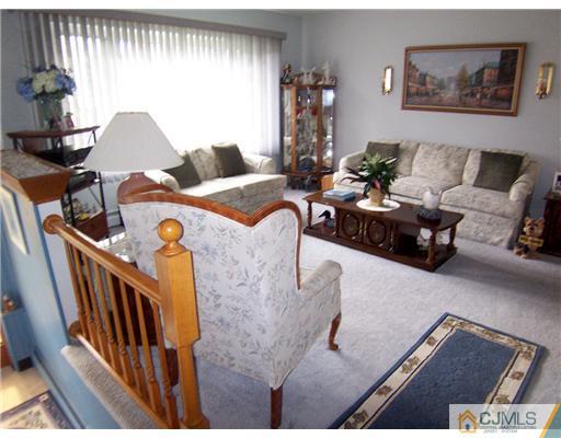 54 Oxford Road Colonia, NJ 07067 - Photo 9 of 18 a living room with furniture and wooden floor