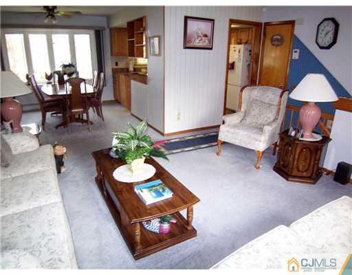 54 Oxford Road Colonia, NJ 07067 - Photo 10 of 18 a living room with furniture and a table