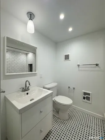 a kitchen with stainless steel appliances granite countertop a stove sink and cabinets