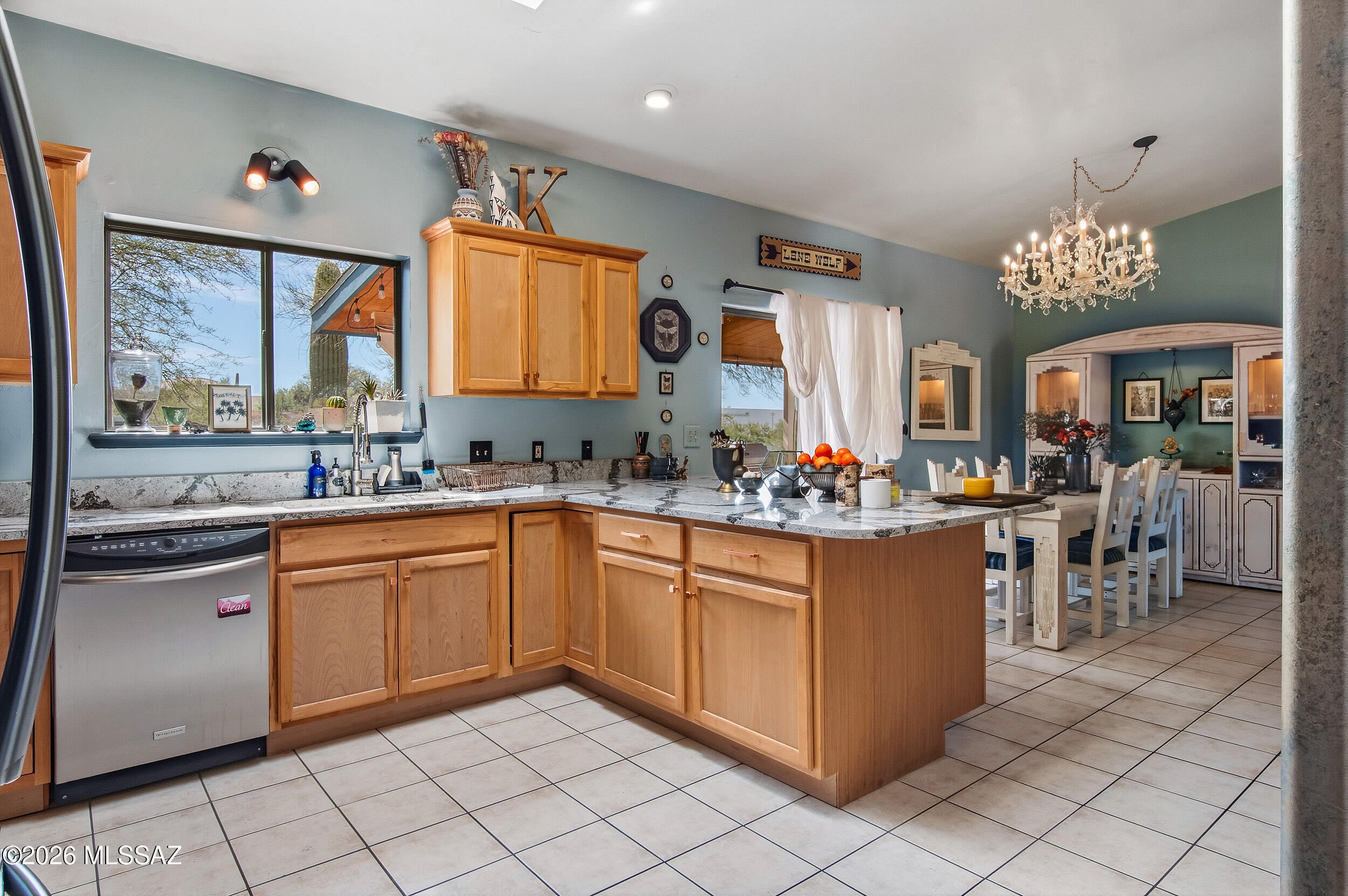 4155 West Coyote Ridge Trail Tucson, AZ 85746 - Photo 21 of 39 a kitchen with stainless steel appliances granite countertop a sink counter space and a window