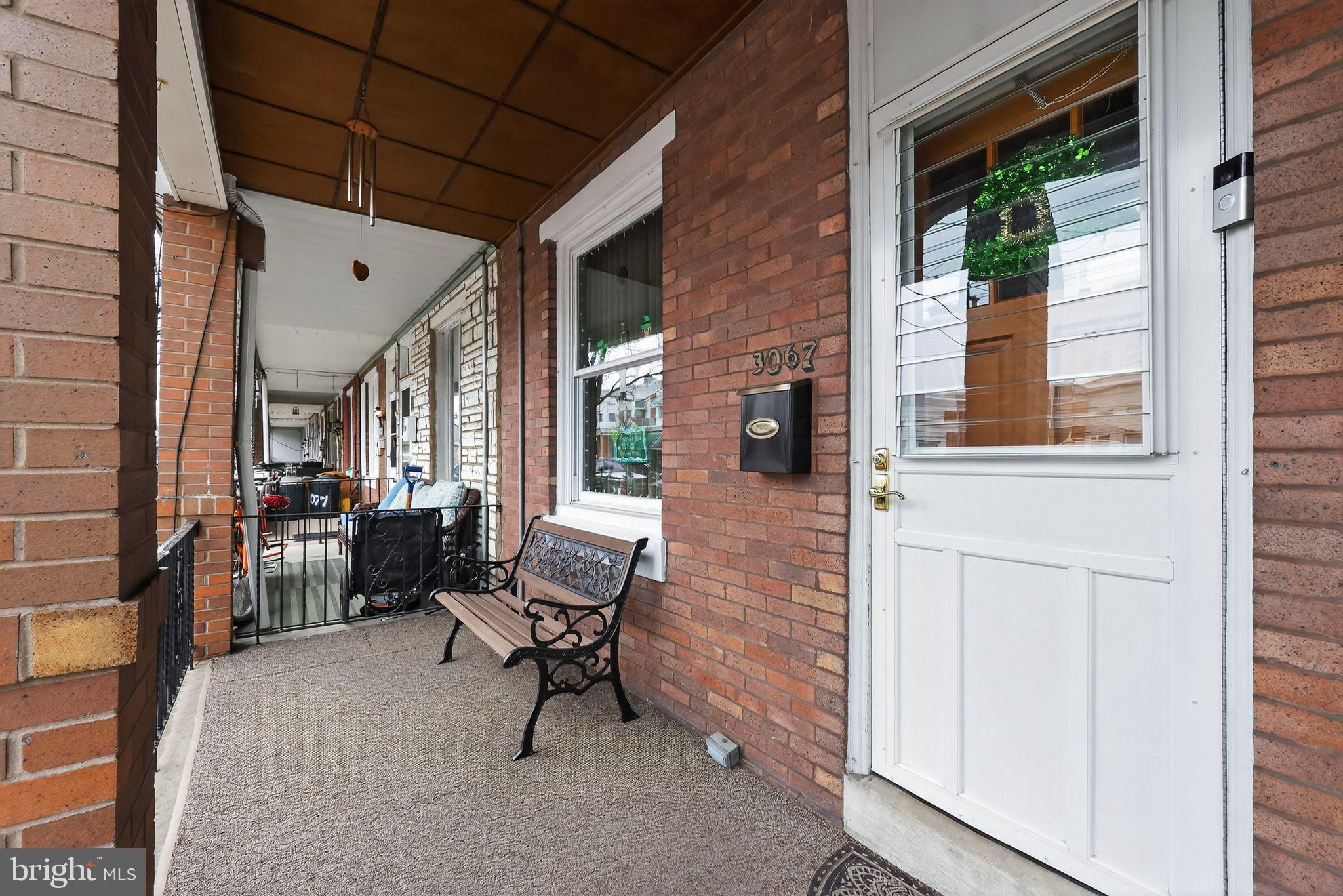 a balcony with furniture and a window