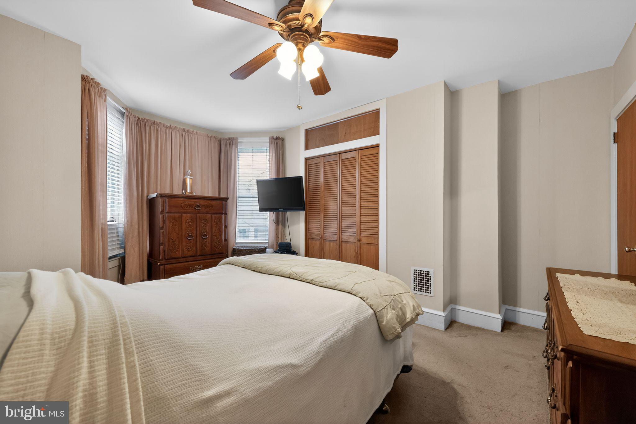 3067 Cedar Street Philadelphia, PA 19134 - Photo 20 of 30 a bedroom with a bed and a chandelier