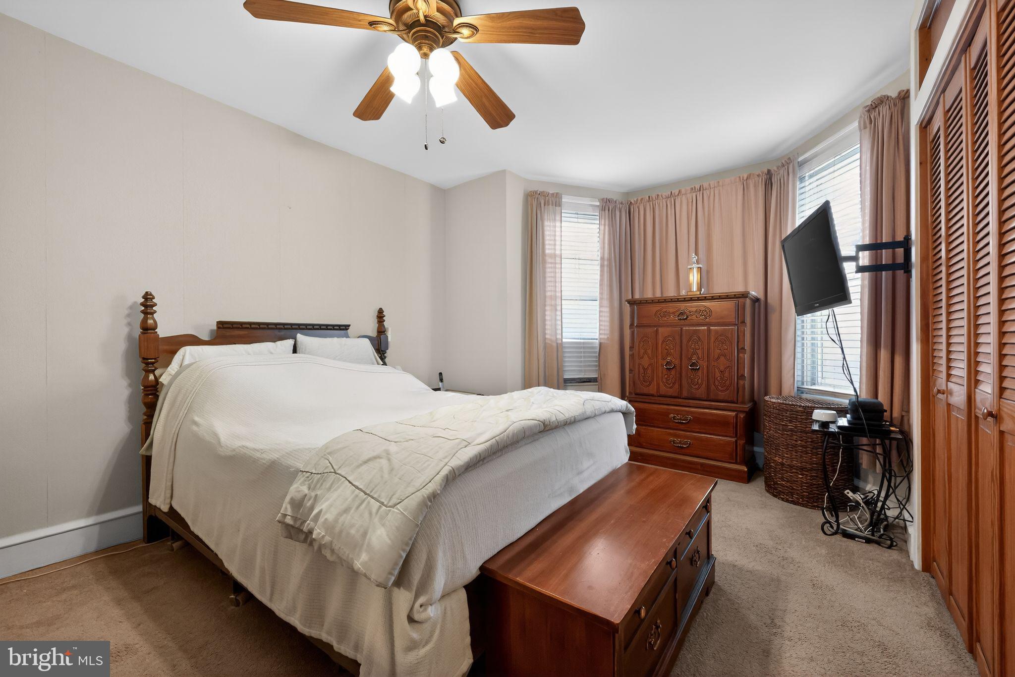 3067 Cedar Street Philadelphia, PA 19134 - Photo 21 of 30 a bedroom with a bed and a flat screen tv