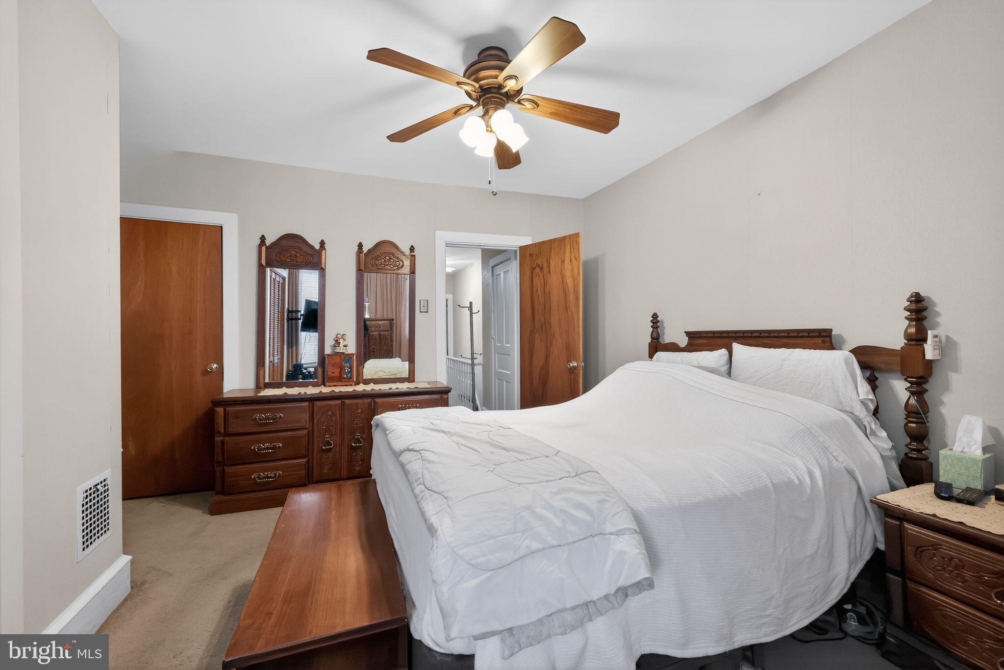 3067 Cedar Street Philadelphia, PA 19134 - Photo 22 of 30 a large bedroom with a bed and wooden floor