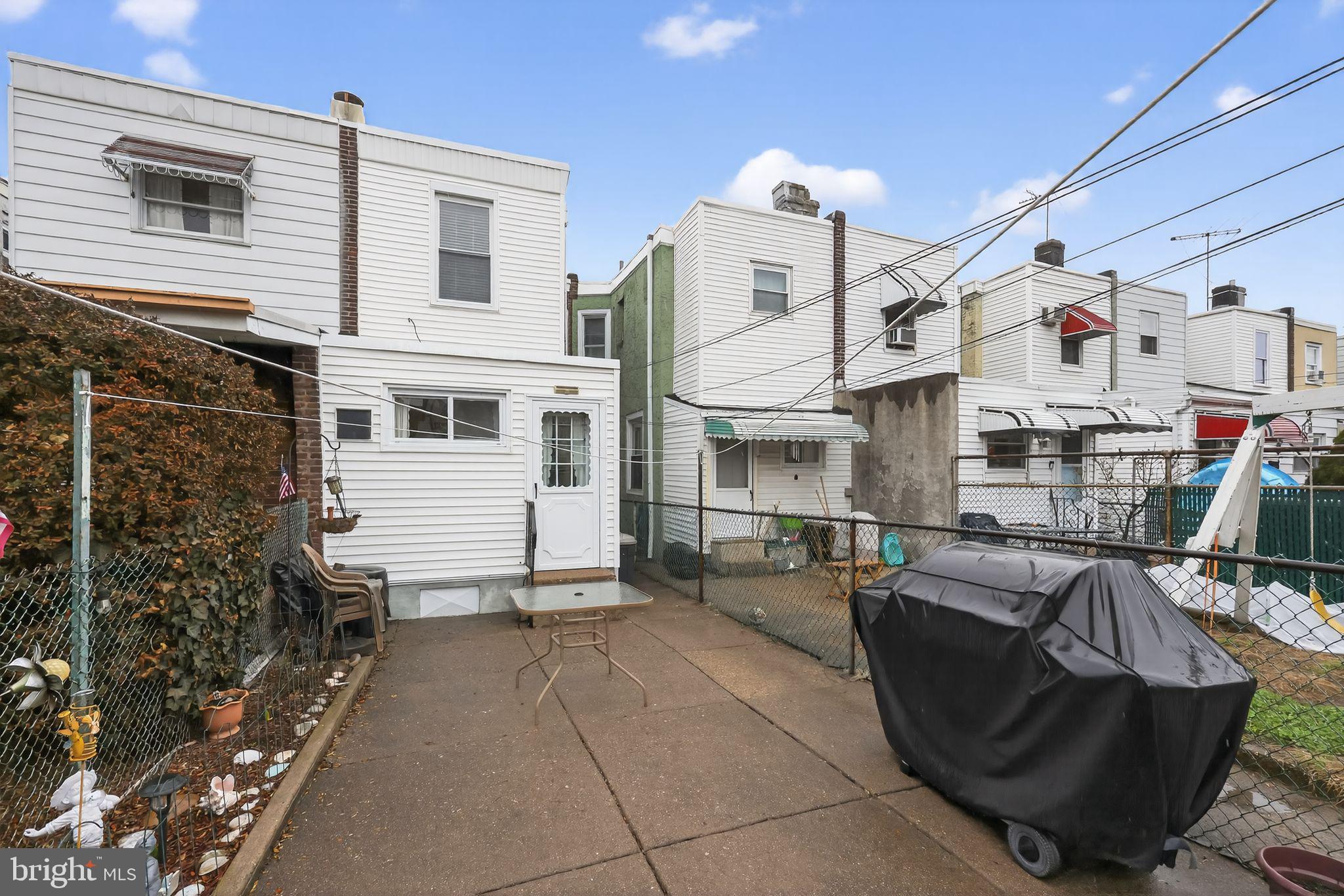 3067 Cedar Street Philadelphia, PA 19134 - Photo 28 of 30 a view of a patio with table and chairs potted plants