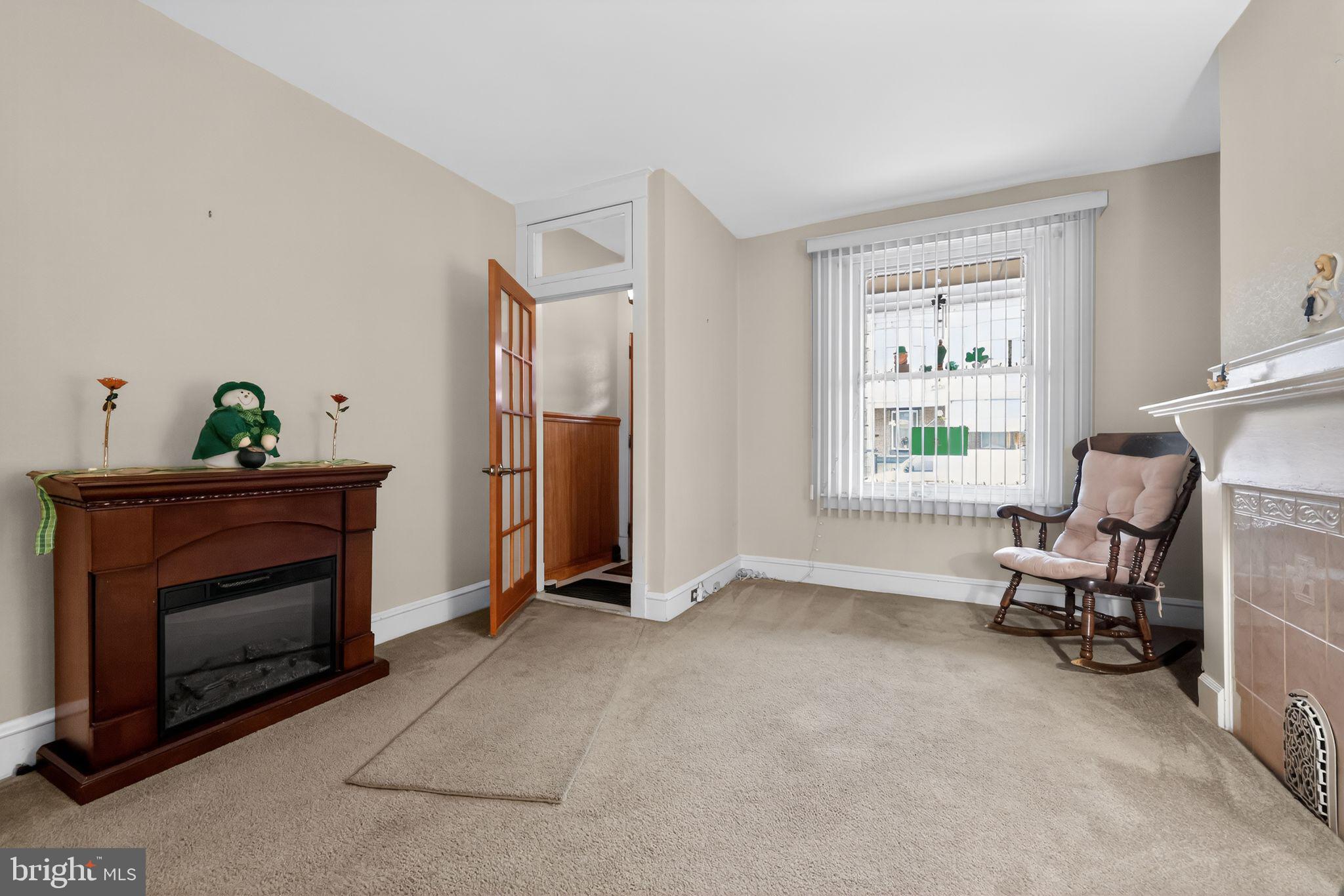 3067 Cedar Street Philadelphia, PA 19134 - Photo 7 of 30 a living room with furniture and a fireplace