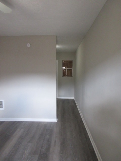 784 Terminal Court, Unit 4 Columbus, GA 31906 - Photo 3 of 22 an empty room with wooden floor and windows