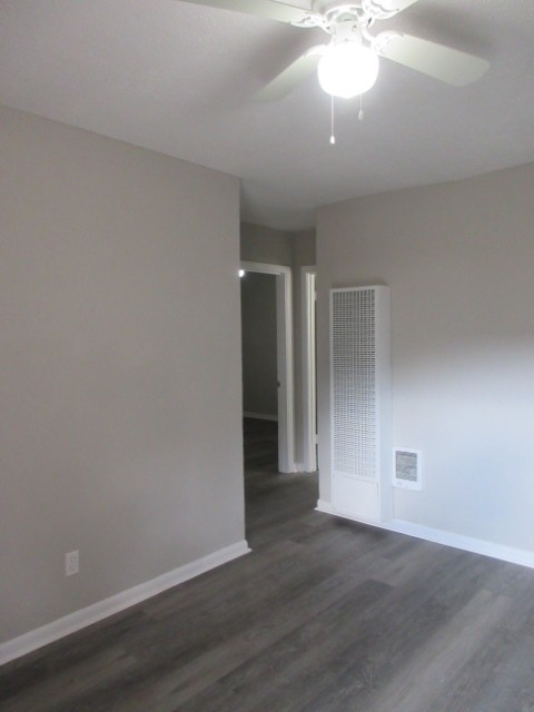 784 Terminal Court, Unit 4 Columbus, GA 31906 - Photo 4 of 22 a view of an empty room with wooden floor and a window