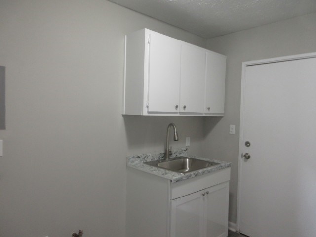 784 Terminal Court, Unit 4 Columbus, GA 31906 - Photo 6 of 22 a kitchen with a sink and cabinets