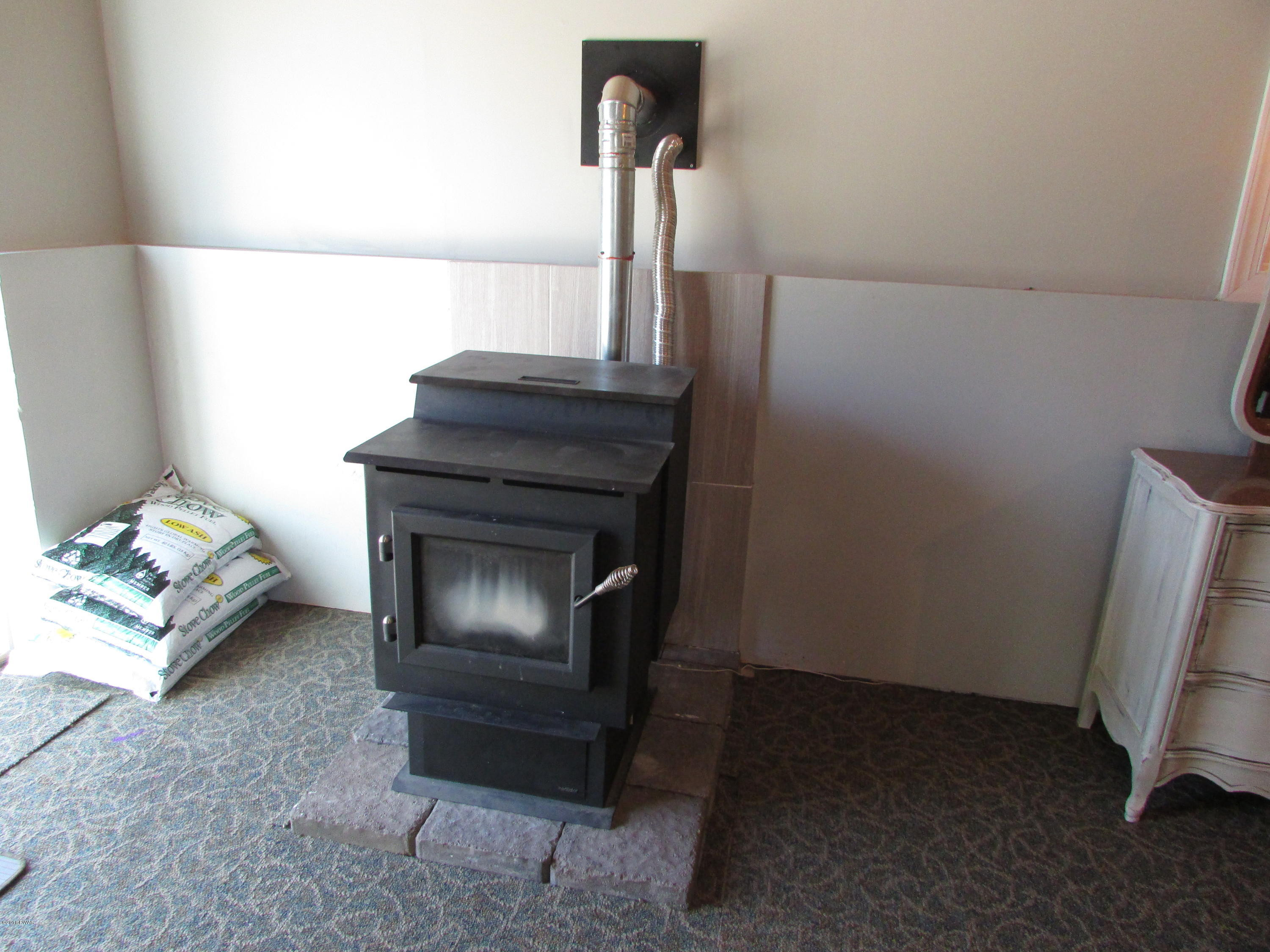 167 Pedersen Ridge Road Milford, PA 18337 - Photo 15 of 19 Lower level pellet stove