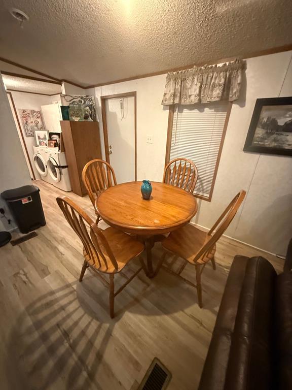 641 Sky Camp Loop, Unit 12 Graford, TX 76449 - Photo 13 of 14 a dining room with furniture and window