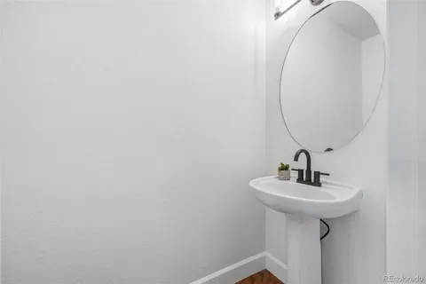 a bathroom with a sink and mirror