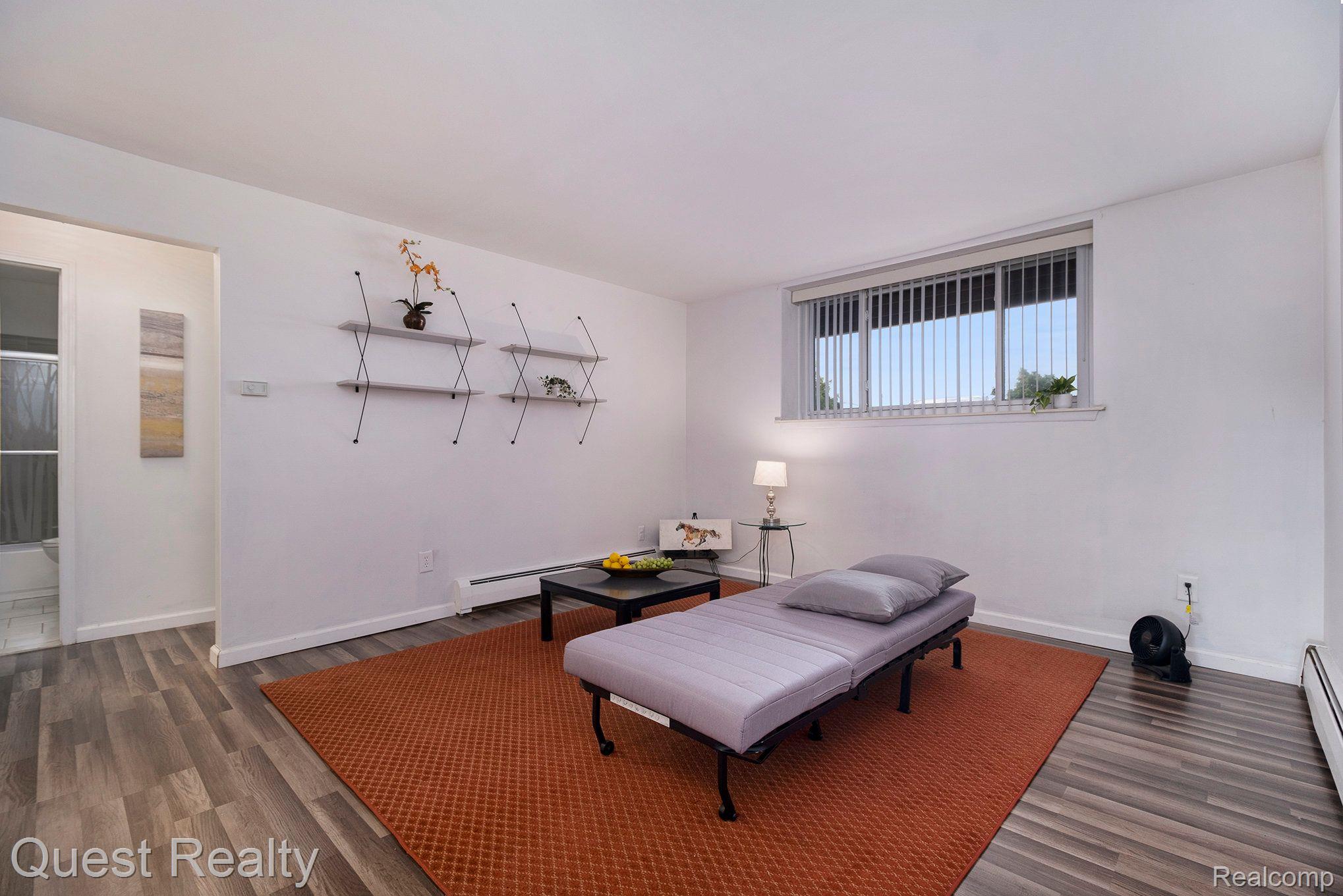 4905 Crooks Road, Unit B2 Royal Oak, MI 48073 - Photo 3 of 17 Living room with newer flooring