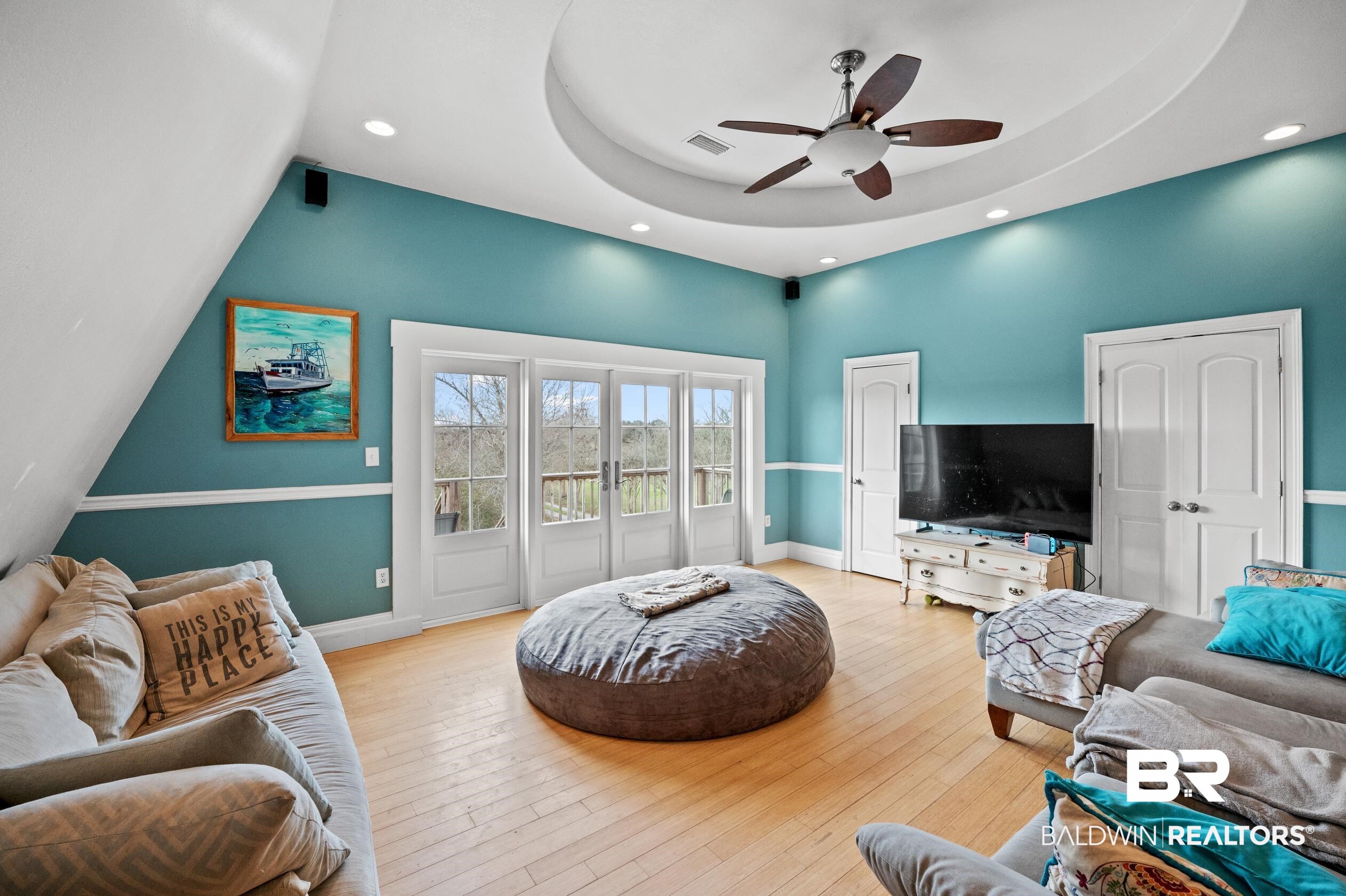 13358 County Road 91 Elberta, AL 36530 - Photo 4 of 47 Living room with ceiling fan, light hardwood / wood-style flooring, french doors, and a raised ceiling