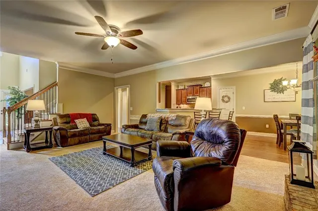 a living room with furniture and a rug