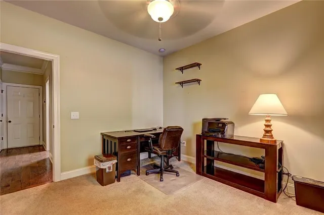 a view of a workspace with furniture