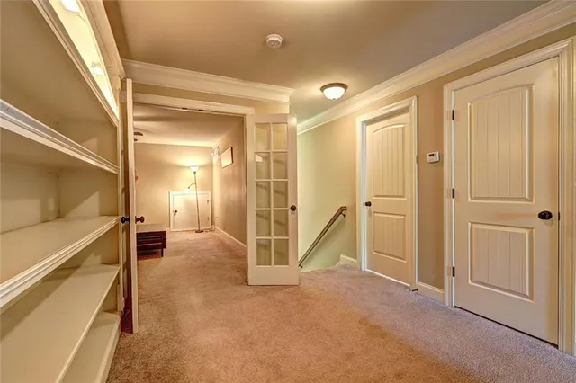 a view of a hallway with wooden walls