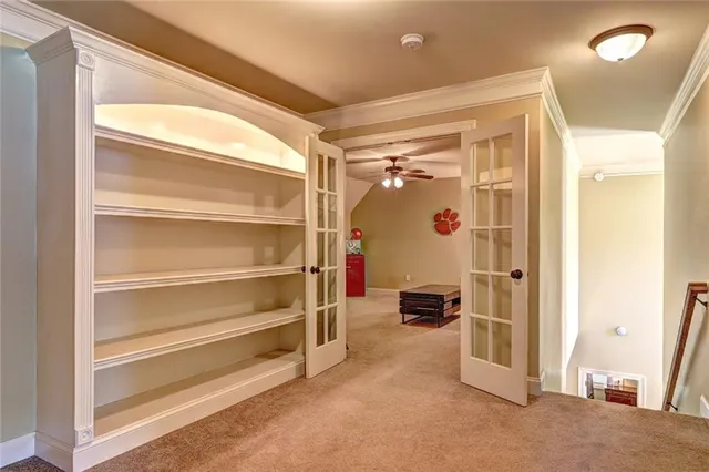 a view of a hallway with closet and wooden floor