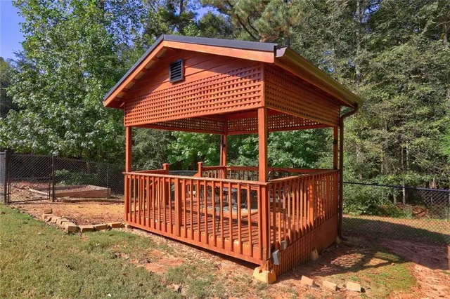 a view of a small house with a roof deck