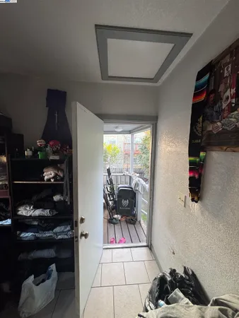 a living room with furniture a dining table and a floor to ceiling window