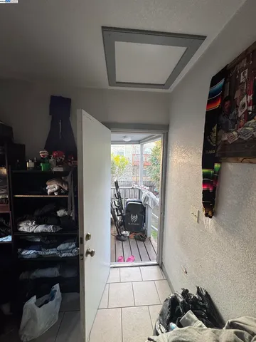 a living room with furniture a dining table and a floor to ceiling window