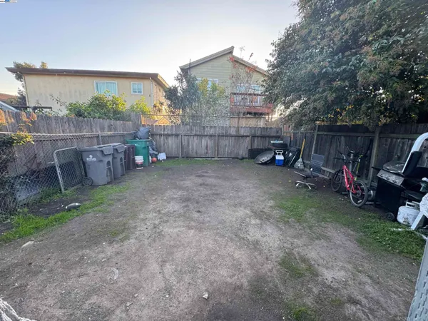 a view of a backyard with a car parked in it