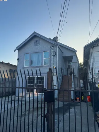 a view of a house with wooden deck