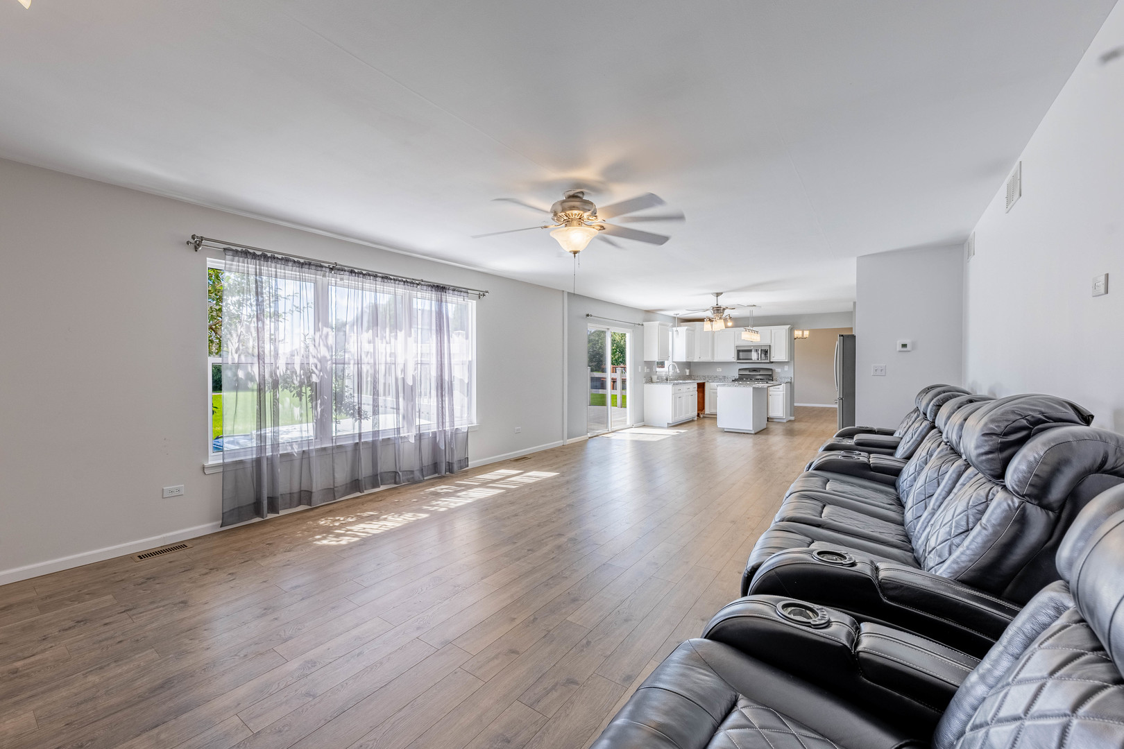 16263 Celtic Circle Manhattan, IL 60442 - Photo 16 of 45 a living room with furniture and a wooden floor
