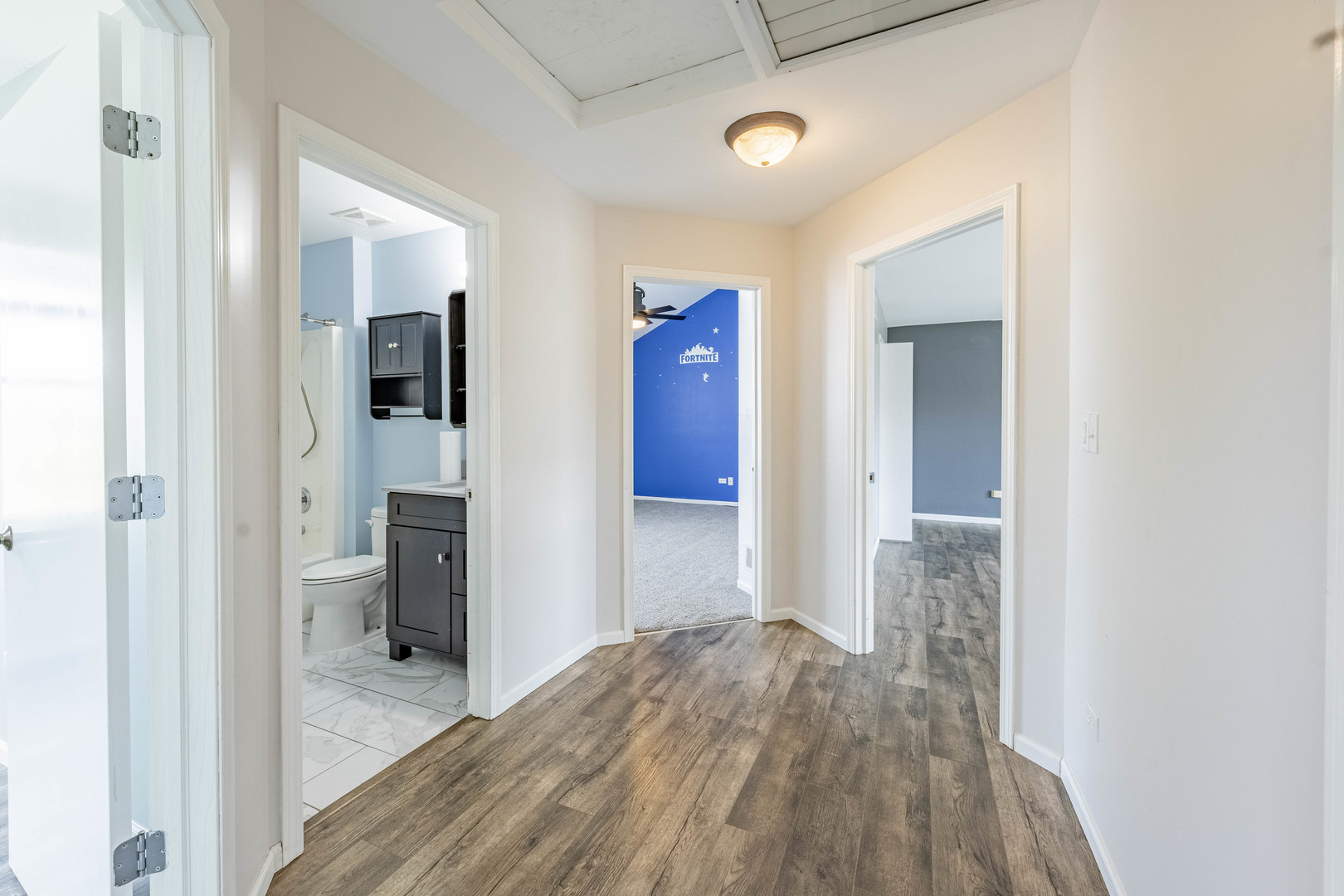 16263 Celtic Circle Manhattan, IL 60442 - Photo 21 of 45 a view of a bedroom with wooden floor and bathroom