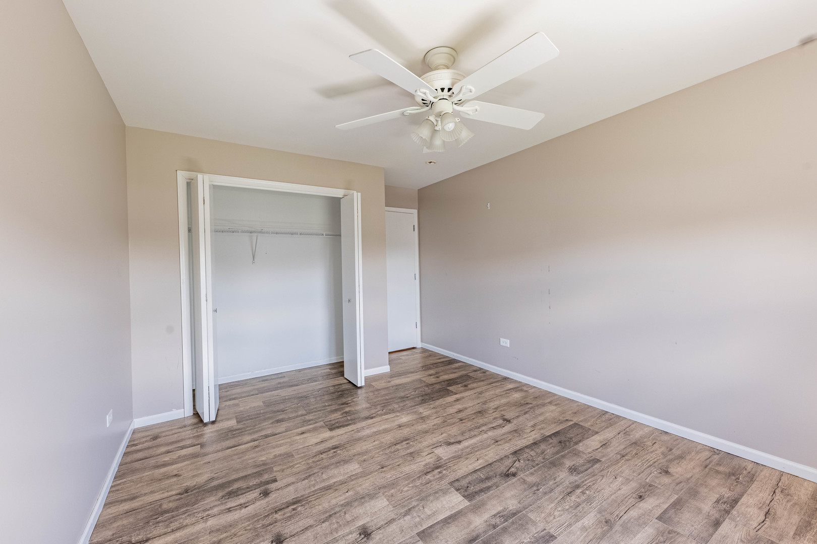 16263 Celtic Circle Manhattan, IL 60442 - Photo 23 of 45 a view of an empty room with wooden floor