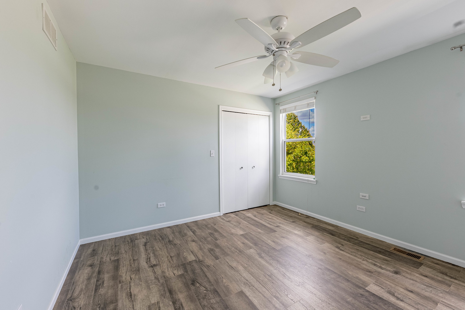 16263 Celtic Circle Manhattan, IL 60442 - Photo 24 of 45 wooden floor in an empty room with a window
