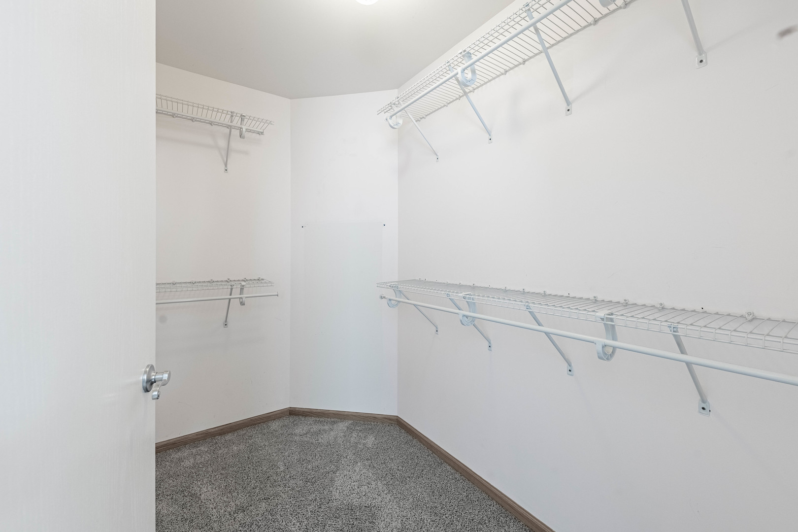 16263 Celtic Circle Manhattan, IL 60442 - Photo 33 of 45 a view of a room with racks on the wall