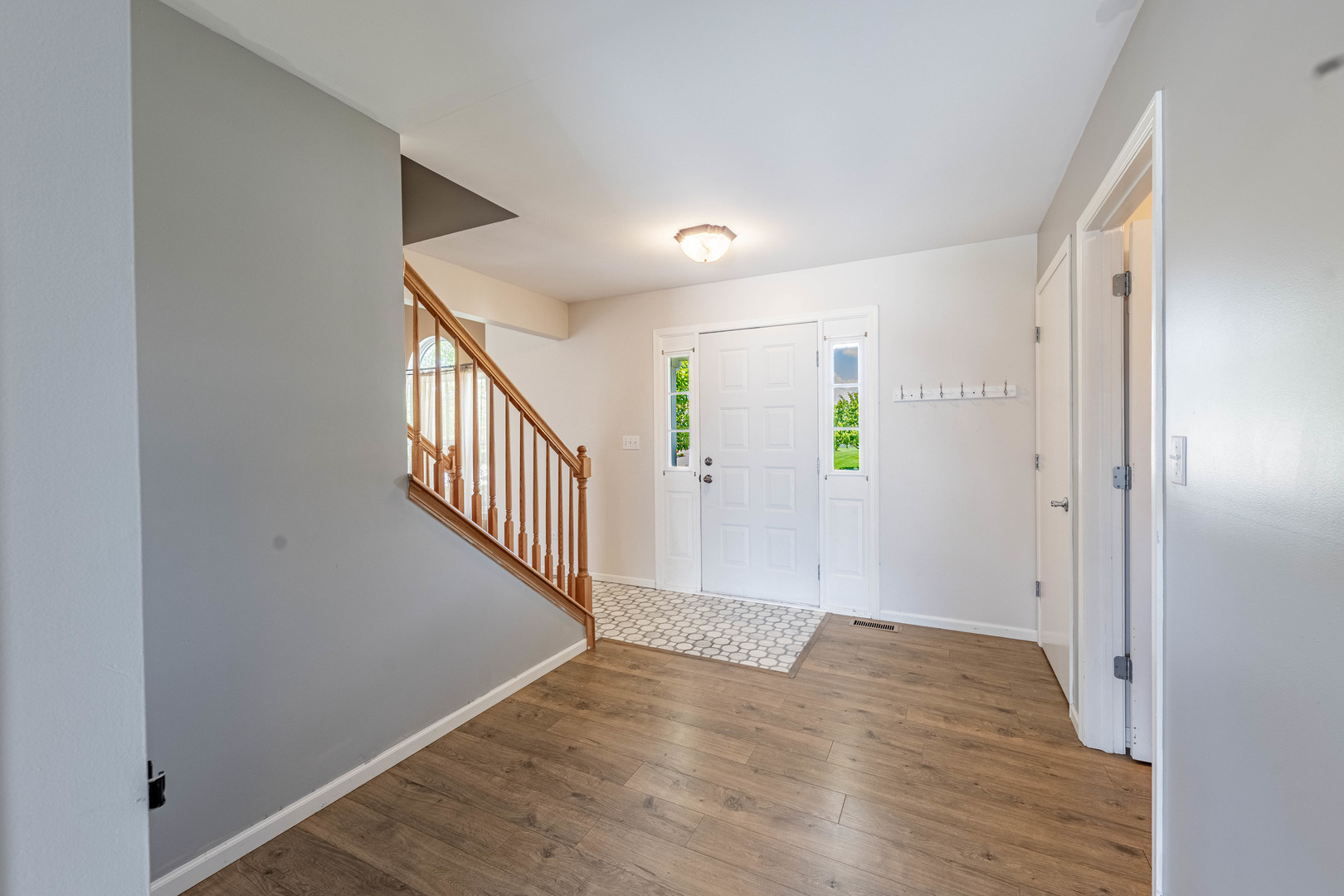 16263 Celtic Circle Manhattan, IL 60442 - Photo 6 of 45 a view of an entryway with wooden floor