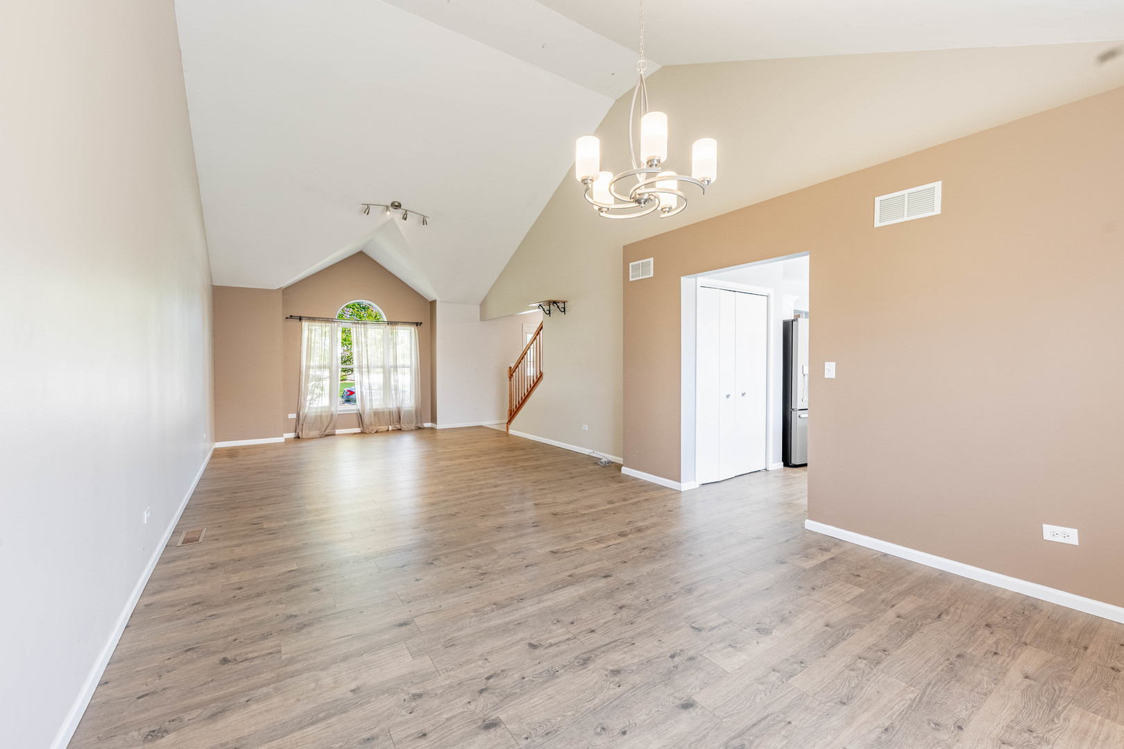 16263 Celtic Circle Manhattan, IL 60442 - Photo 9 of 45 wooden floor in an empty room with a window