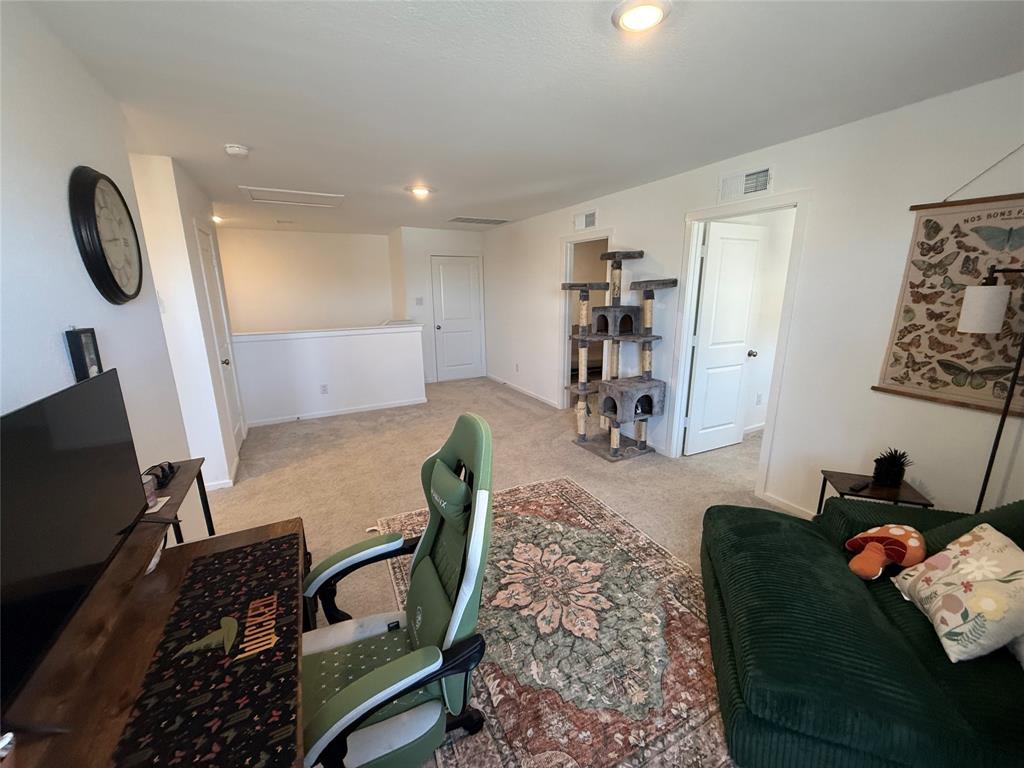 14120 Hammersmith Street Pilot Point, TX 76258 - Photo 5 of 12 a living room with furniture and a flat screen tv