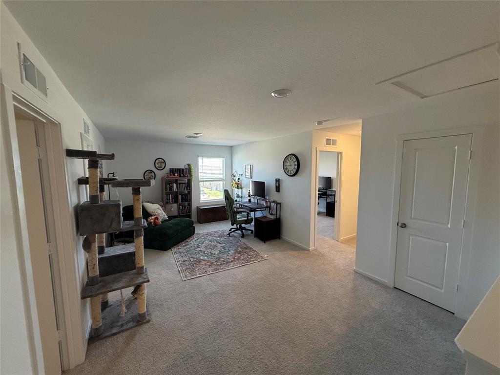 14120 Hammersmith Street Pilot Point, TX 76258 - Photo 6 of 12 a view of a livingroom with furniture and a livingroom