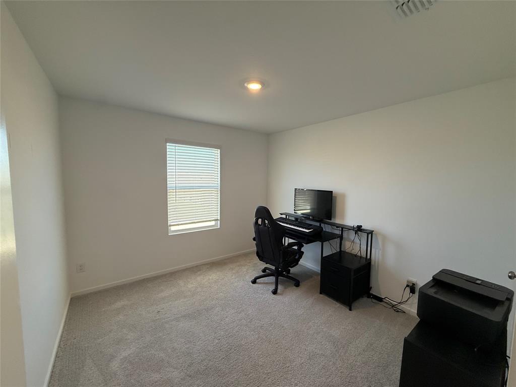 14120 Hammersmith Street Pilot Point, TX 76258 - Photo 8 of 12 a view of a workspace with a window