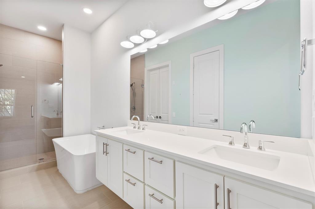 15875 Spectrum Drive, Unit 1106 Addison, TX 75001 - Photo 16 of 39 a bathroom with a double vanity sink mirror and toilet