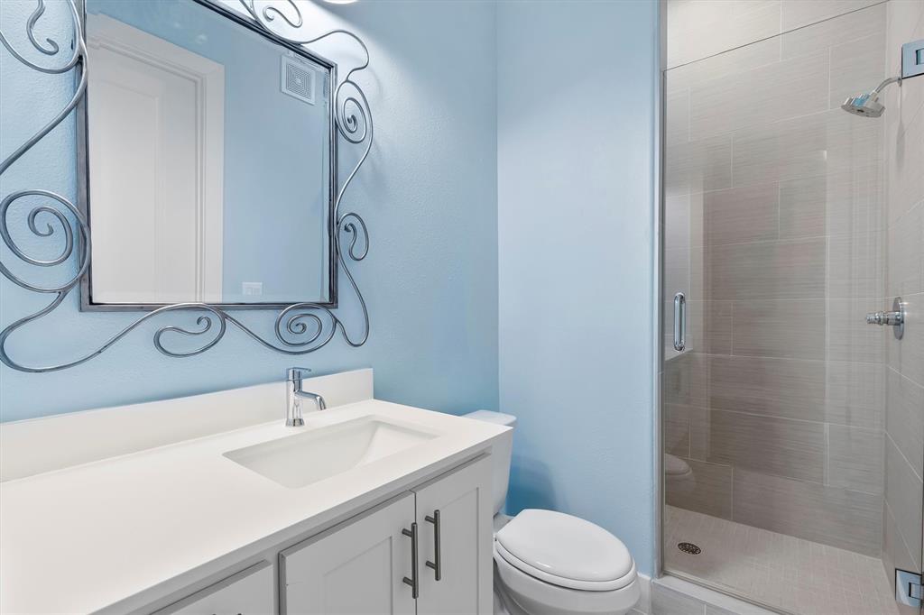 15875 Spectrum Drive, Unit 1106 Addison, TX 75001 - Photo 21 of 39 Full bath featuring vanity and a stall shower