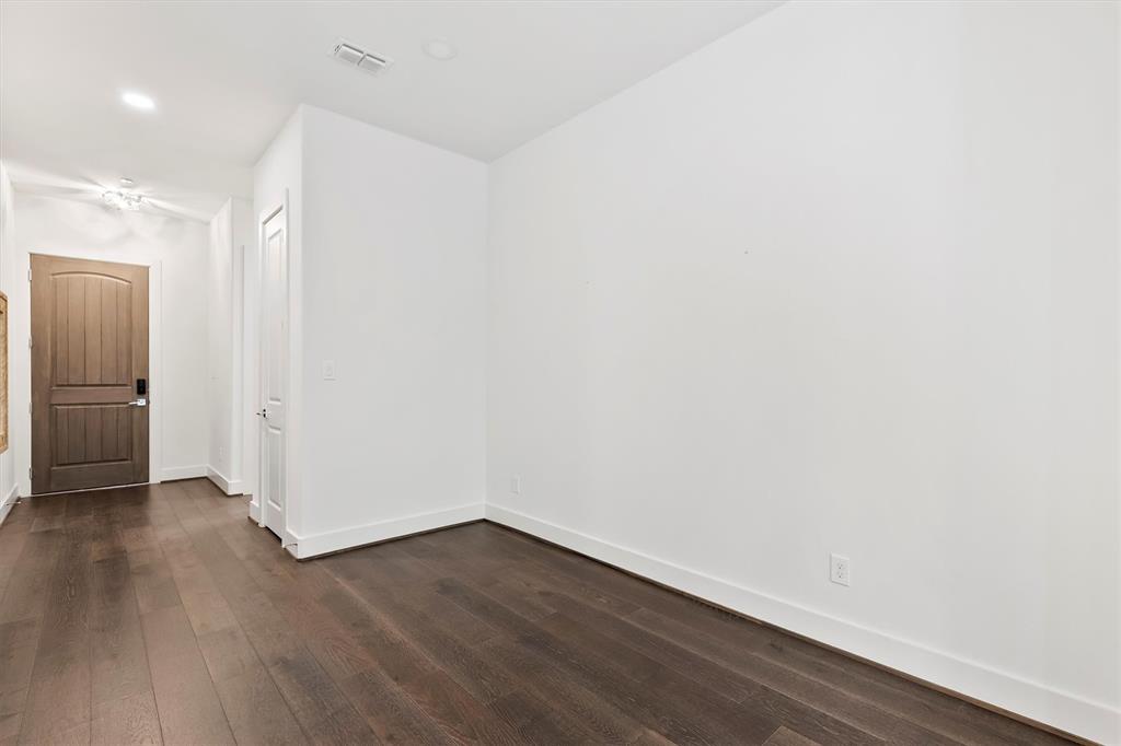 15875 Spectrum Drive, Unit 1106 Addison, TX 75001 - Photo 22 of 39 Unfurnished room with dark wood flooring and recessed lighting