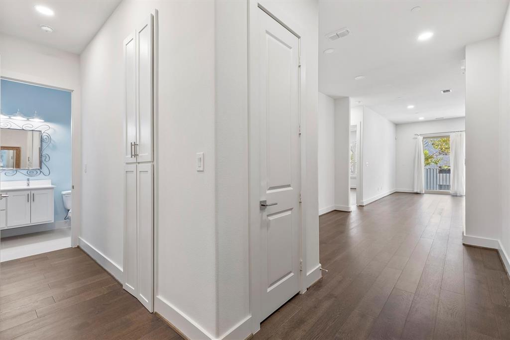 15875 Spectrum Drive, Unit 1106 Addison, TX 75001 - Photo 23 of 39 Hall with recessed lighting and dark wood floors
