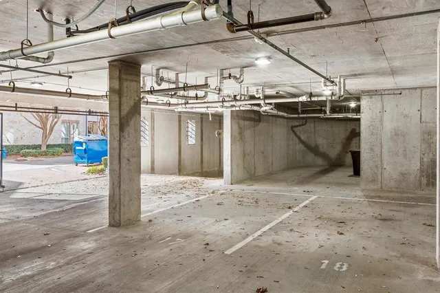 a view of a hallway with wooden floor and closet