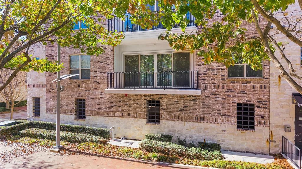15875 Spectrum Drive, Unit 1106 Addison, TX 75001 - Photo 31 of 39 a front view of a house with garden